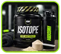 Bote de ISOTOPE junto a shaker y cuchara medidora